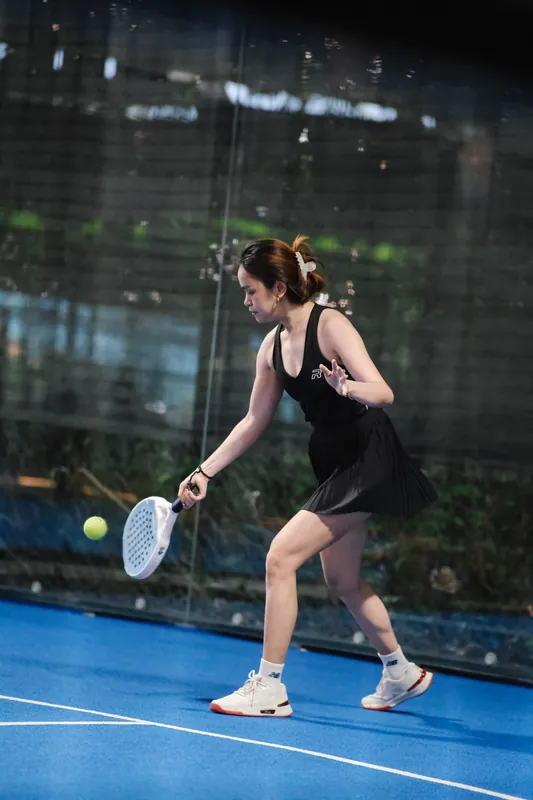 Coach Gim playing a forehand