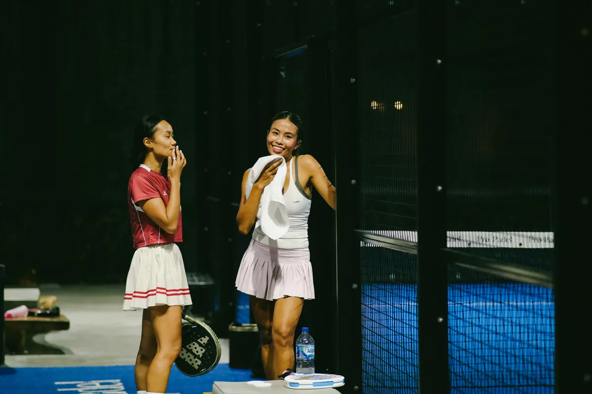 Two players laughing between points