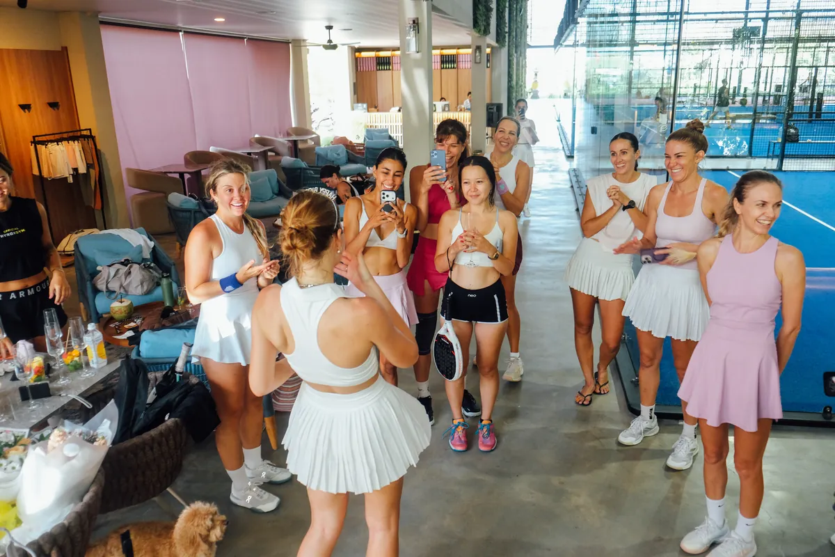 A group celebrating a padel event in the club